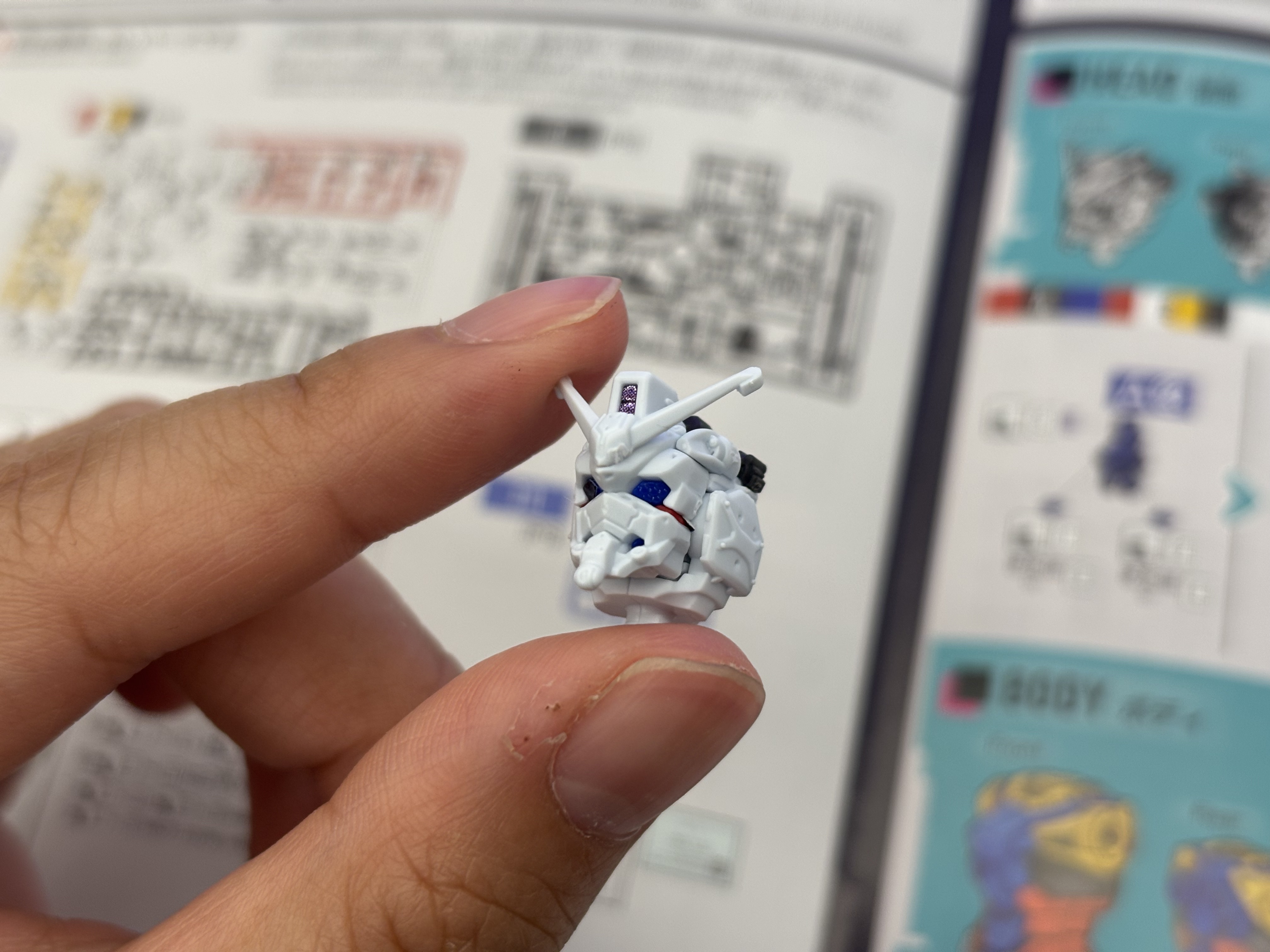 Front view of assembled Wing Gundam head subassembly.